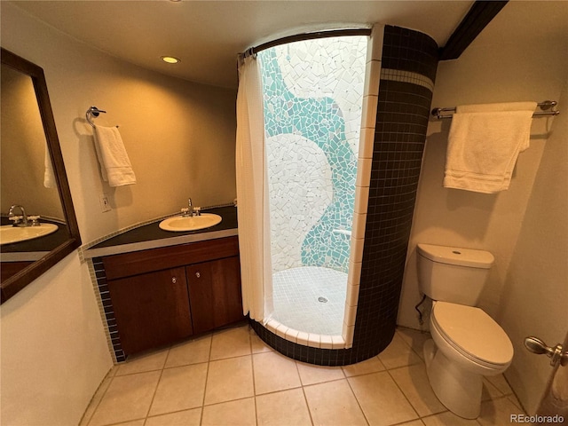 bathroom with a shower with curtain, tile patterned floors, vanity, and toilet