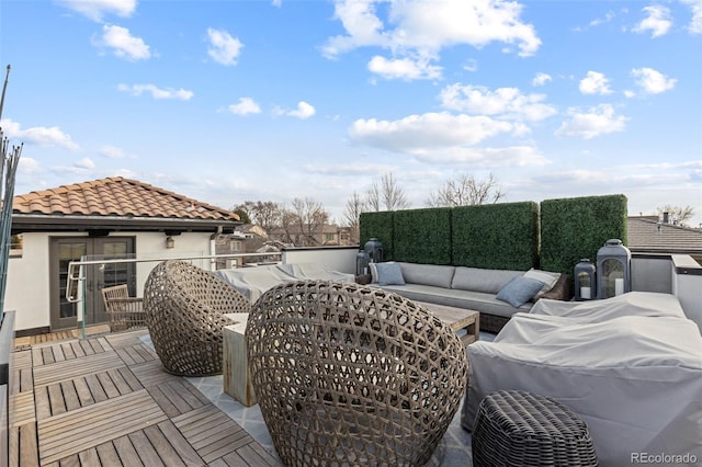 wooden deck with outdoor lounge area