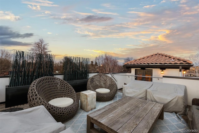 patio terrace at dusk with a balcony