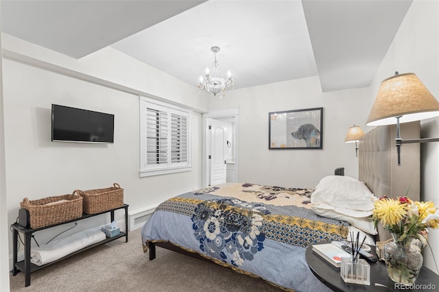 carpeted bedroom with a chandelier and baseboards