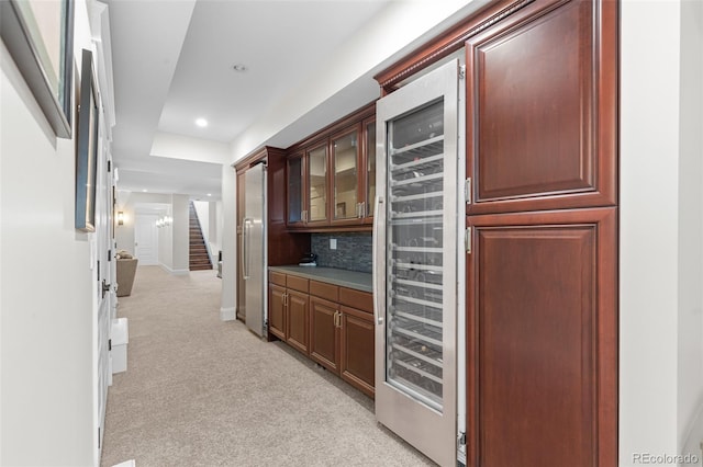 bar with light carpet, decorative backsplash, wine cooler, stairway, and recessed lighting