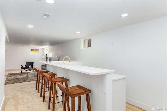 7120 S Sheridan Ct, Littleton, CO 80128 - indoor bar with recessed lighting, baseboards, and light carpet