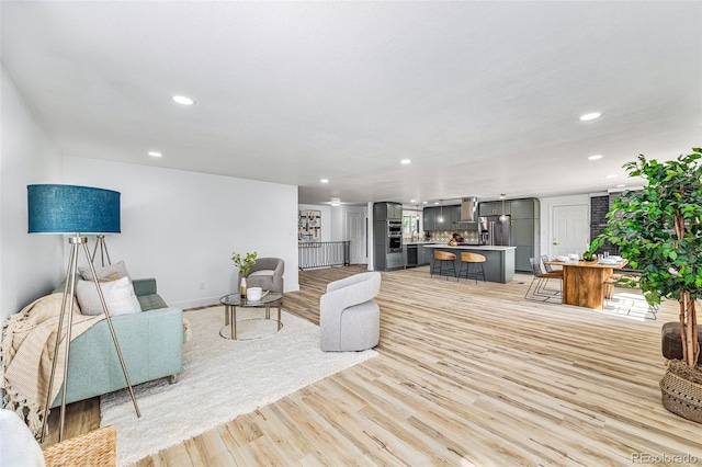 7120 S Sheridan Ct, Littleton, CO 80128 - living room with recessed lighting, light wood-type flooring, and baseboards
