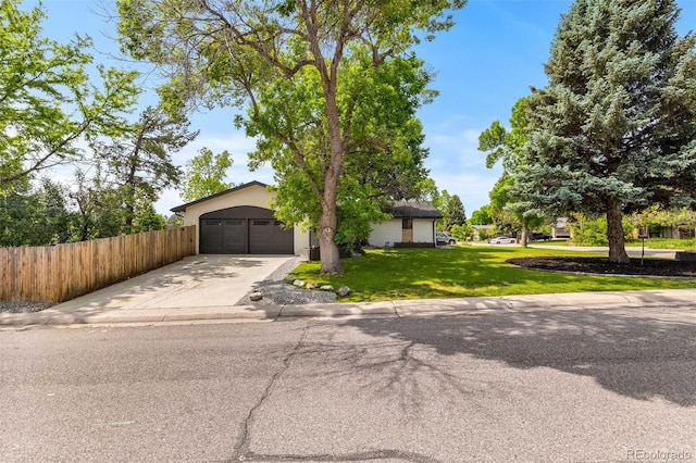 7120 S Sheridan Ct, Littleton, CO 80128 - view of front of home featuring driveway, an attached garage, and stucco siding