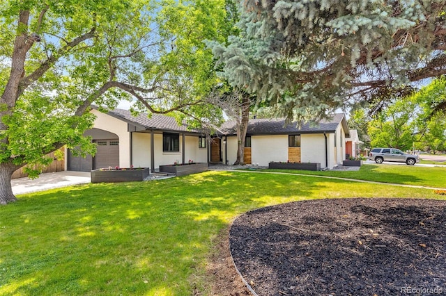 7120 S Sheridan Ct, Littleton, CO 80128 - view of front of home with a garage, a front lawn, and concrete driveway
