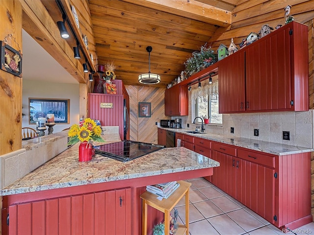 kitchen with tasteful backsplash, lofted ceiling, light tile patterned floors, a sink, and dishwasher