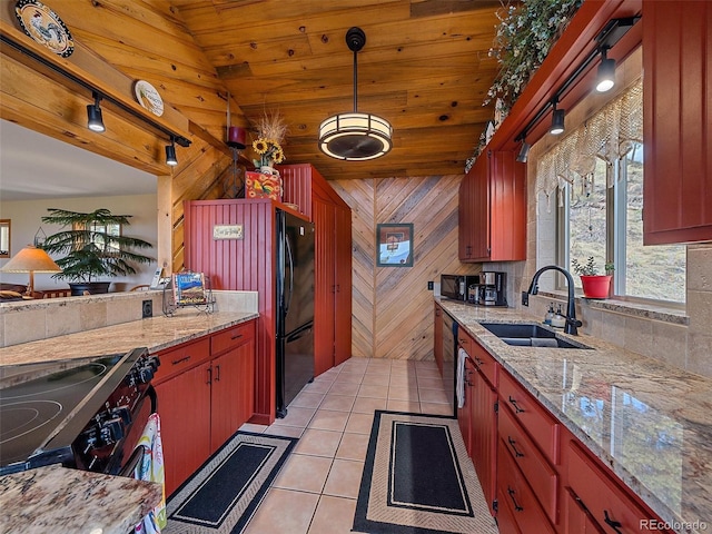 kitchen with light tile patterned flooring, tasteful backsplash, a sink, electric range oven, and pendant lighting