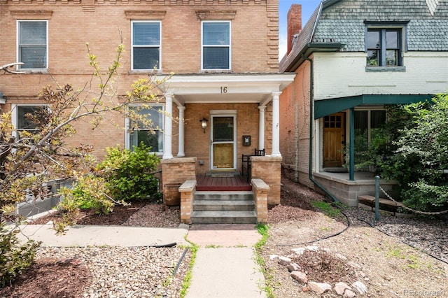 14 S Lincoln St Unit 16, Denver, CO 80209 - view of exterior entry with brick siding and covered porch