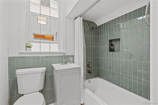 14 S Lincoln St Unit 16, Denver, CO 80209 - bathroom with tile walls, shower / tub combo, and vanity