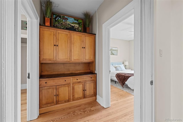 14 S Lincoln St Unit 16, Denver, CO 80209 - hallway featuring light wood-style flooring and baseboards