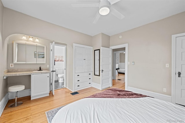 14 S Lincoln St Unit 16, Denver, CO 80209 - bedroom with light wood-style flooring, ensuite bath, and ceiling fan
