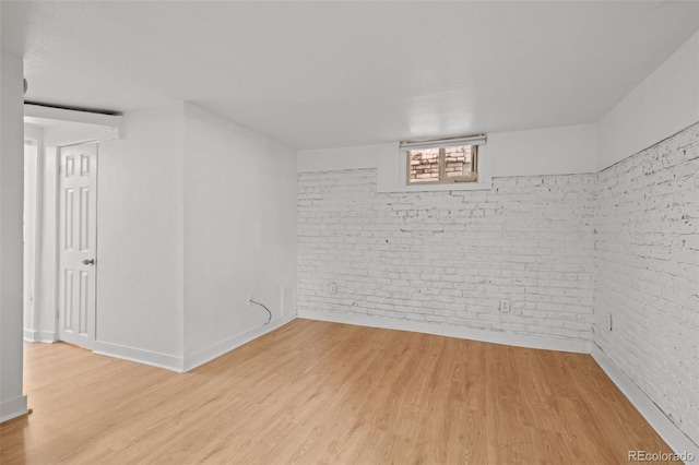 14 S Lincoln St Unit 16, Denver, CO 80209 - empty room with brick wall and light wood-style floors