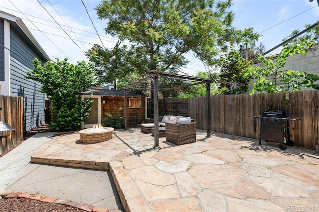 14 S Lincoln St Unit 16, Denver, CO 80209 - fenced backyard featuring a patio area, area for grilling, an outdoor living space with a fire pit, and an outbuilding