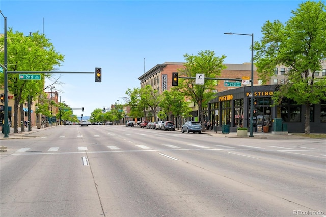 14 S Lincoln St Unit 16, Denver, CO 80209 - view of asphalt road featuring traffic lights, street lights, sidewalks, and curbs