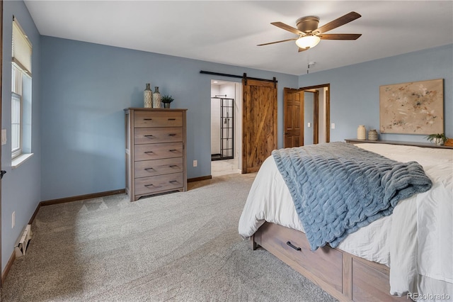 5292 W Fair Dr, Littleton, CO 80123 - carpeted bedroom featuring a barn door, a ceiling fan, and ensuite bathroom