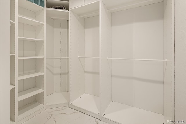 5292 W Fair Dr, Littleton, CO 80123 - spacious closet featuring marble look tile flooring