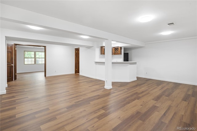 5292 W Fair Dr, Littleton, CO 80123 - below grade area featuring dark wood-style flooring and bar area