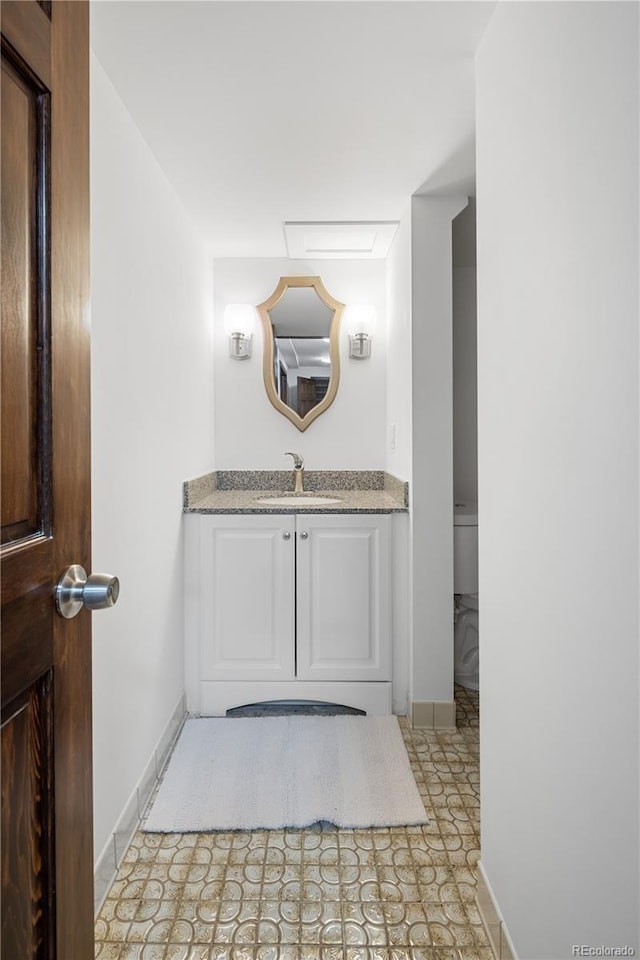5292 W Fair Dr, Littleton, CO 80123 - bathroom with vanity and baseboards