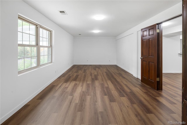 5292 W Fair Dr, Littleton, CO 80123 - spare room featuring dark wood-style floors and healthy amount of natural light