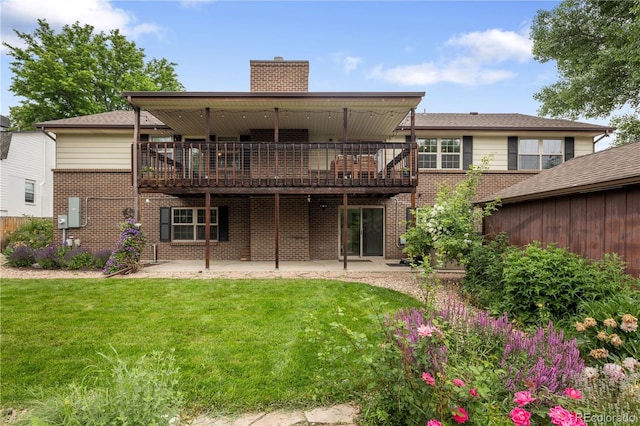 5292 W Fair Dr, Littleton, CO 80123 - back of property featuring a chimney, a lawn, a patio, brick siding, and a deck