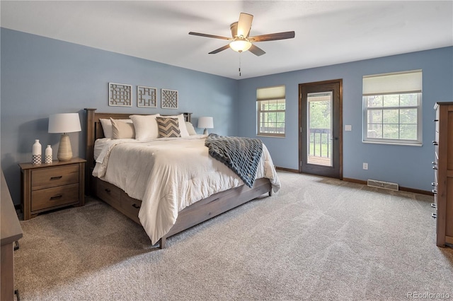5292 W Fair Dr, Littleton, CO 80123 - carpeted bedroom featuring access to outside, multiple windows, and ceiling fan