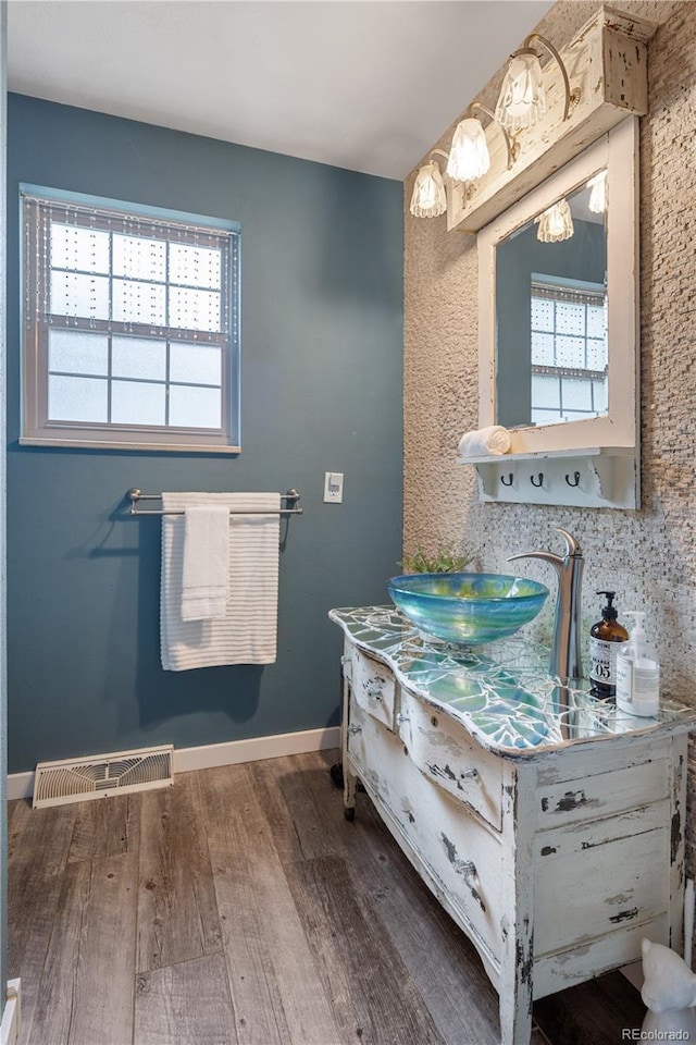 5292 W Fair Dr, Littleton, CO 80123 - bathroom featuring wood finished floors and vanity