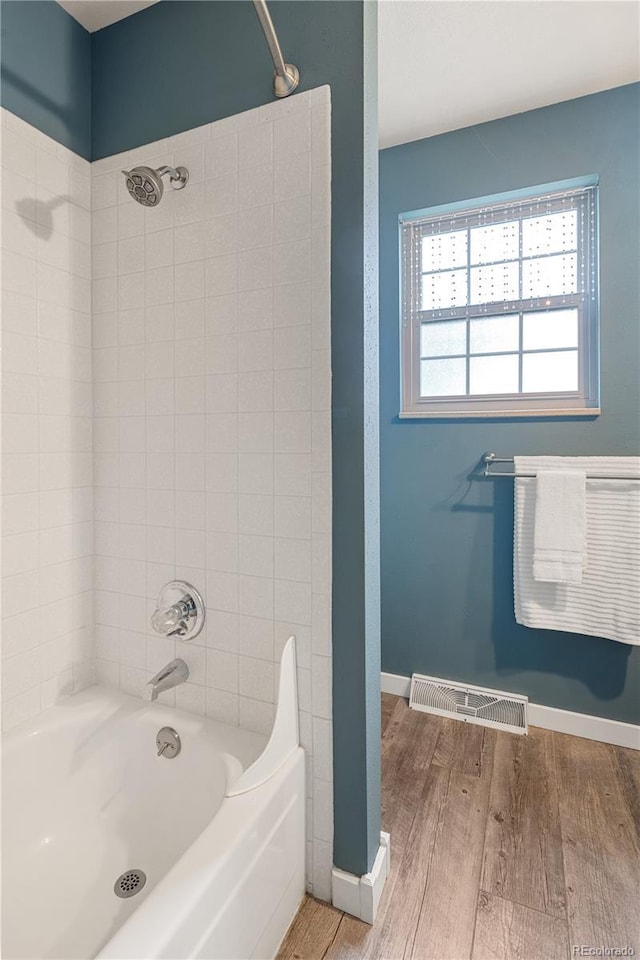 5292 W Fair Dr, Littleton, CO 80123 - full bath with wood finished floors and  shower combination