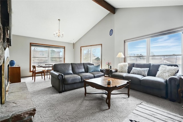 670 Wapiti Dr, Fraser, CO 80442 - living area featuring a chandelier, beamed ceiling, carpet flooring, high vaulted ceiling, and a fireplace