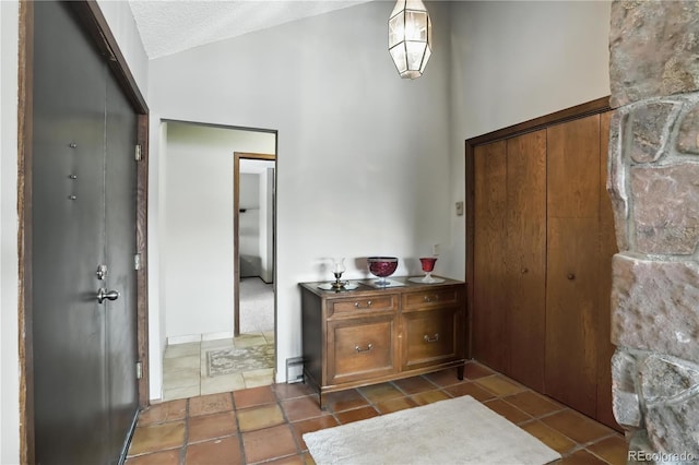 670 Wapiti Dr, Fraser, CO 80442 - entrance foyer with lofted ceiling and a textured ceiling