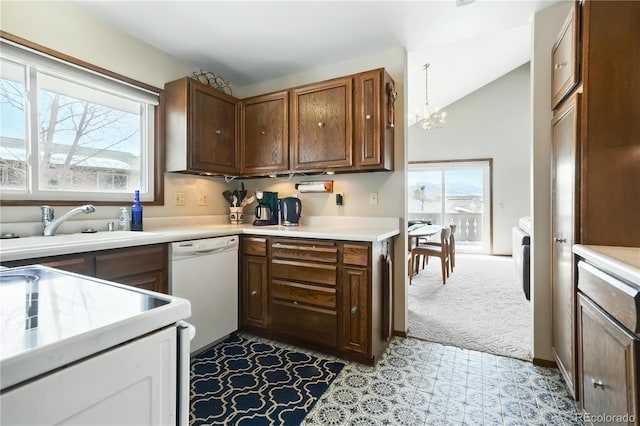 670 Wapiti Dr, Fraser, CO 80442 - kitchen featuring white appliances, healthy amount of natural light, a chandelier, light countertops, and lofted ceiling