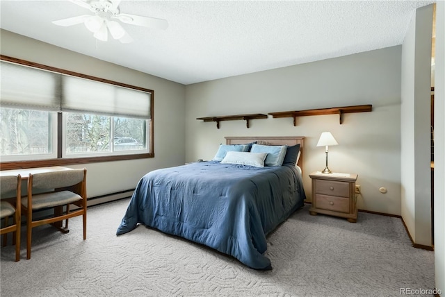 670 Wapiti Dr, Fraser, CO 80442 - carpeted bedroom featuring a baseboard radiator, a textured ceiling, ceiling fan, and baseboards