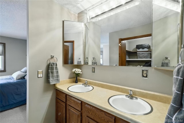 670 Wapiti Dr, Fraser, CO 80442 - ensuite bathroom with a textured ceiling and double vanity