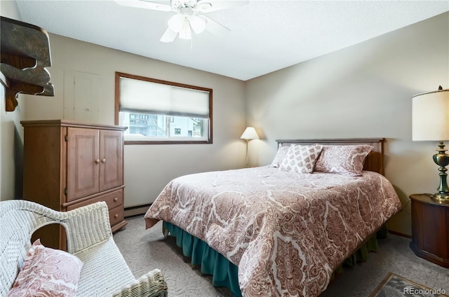 670 Wapiti Dr, Fraser, CO 80442 - bedroom with light colored carpet, baseboard heating, and a ceiling fan