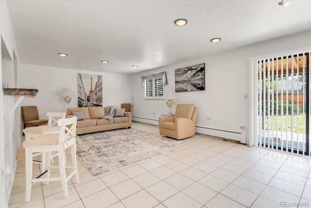 591 Nome St, Aurora, CO 80010 - living room featuring baseboard heating, recessed lighting, and a baseboard heating unit