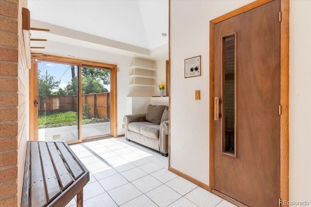 591 Nome St, Aurora, CO 80010 - doorway with light tile patterned flooring and baseboards