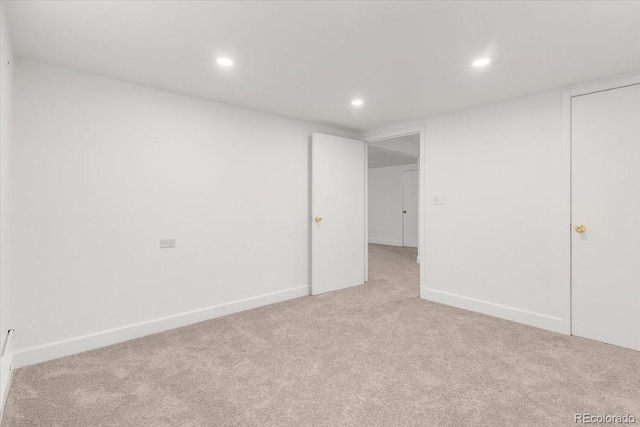 591 Nome St, Aurora, CO 80010 - spare room featuring light carpet and recessed lighting