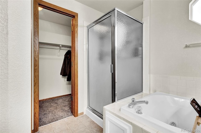 bathroom featuring independent shower and bath and tile patterned floors