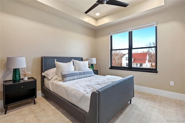 302 N Meldrum St Unit 206, Fort Collins, CO 80521 - bedroom featuring a tray ceiling, baseboards, a ceiling fan, and carpet