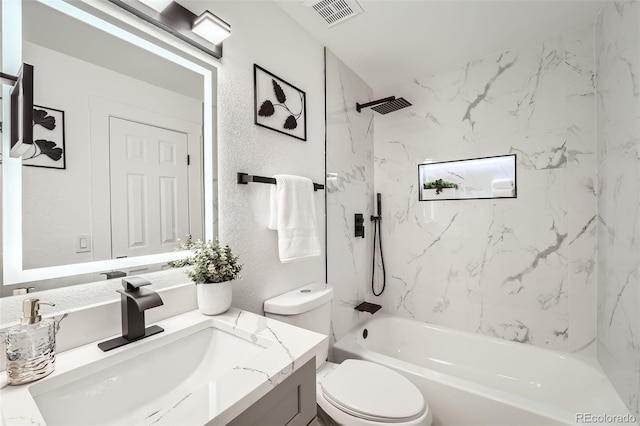 full bathroom featuring vanity, toilet, and tiled shower / bath