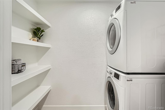 laundry area with stacked washer / drying machine