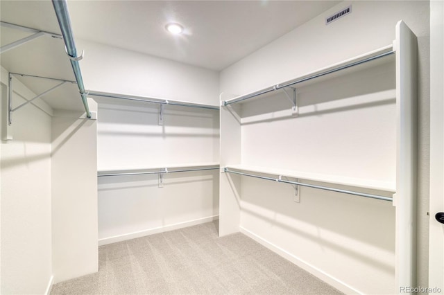 8595 Silverton Ln, Littleton, CO 80125 - walk in closet featuring light carpet