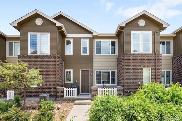 15546 W 64th Loop Unit C, Arvada, CO 80007 - view of property featuring brick siding
