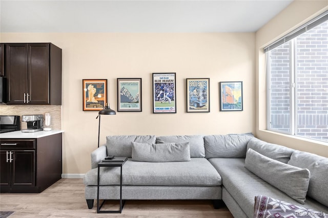 15546 W 64th Loop Unit C, Arvada, CO 80007 - living area with healthy amount of natural light and light wood-style floors