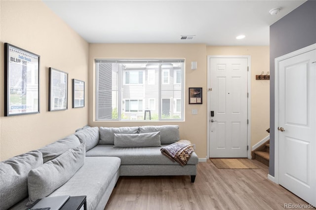 15546 W 64th Loop Unit C, Arvada, CO 80007 - living room featuring light wood-style flooring, recessed lighting, and stairway