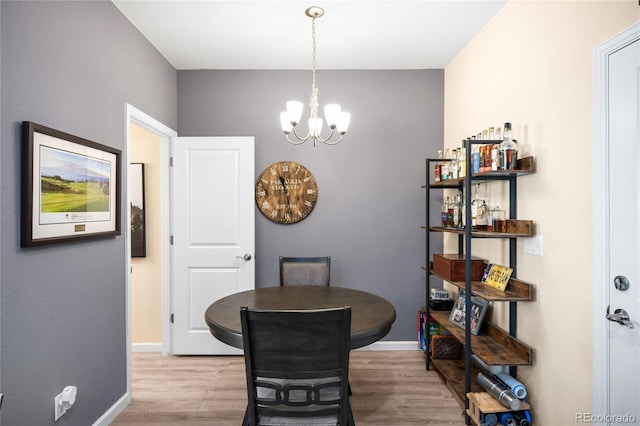 15546 W 64th Loop Unit C, Arvada, CO 80007 - dining area with wood finished floors and a chandelier