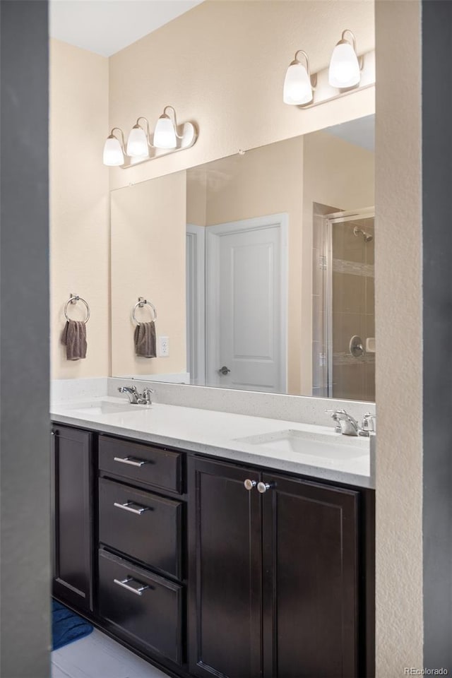 15546 W 64th Loop Unit C, Arvada, CO 80007 - bathroom with a stall shower and double vanity