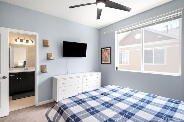 15546 W 64th Loop Unit C, Arvada, CO 80007 - bedroom featuring light colored carpet, ensuite bath, and ceiling fan