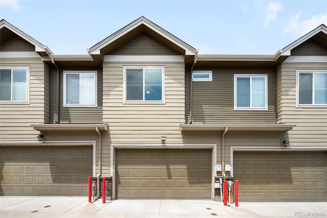 15546 W 64th Loop Unit C, Arvada, CO 80007 - view of front facade with an attached garage and driveway