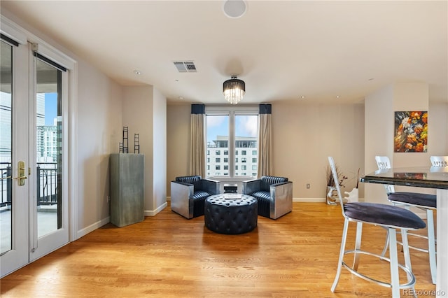 sitting room with light wood finished floors and baseboards