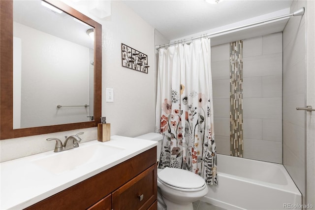 bathroom with toilet, vanity, and shower / tub combo